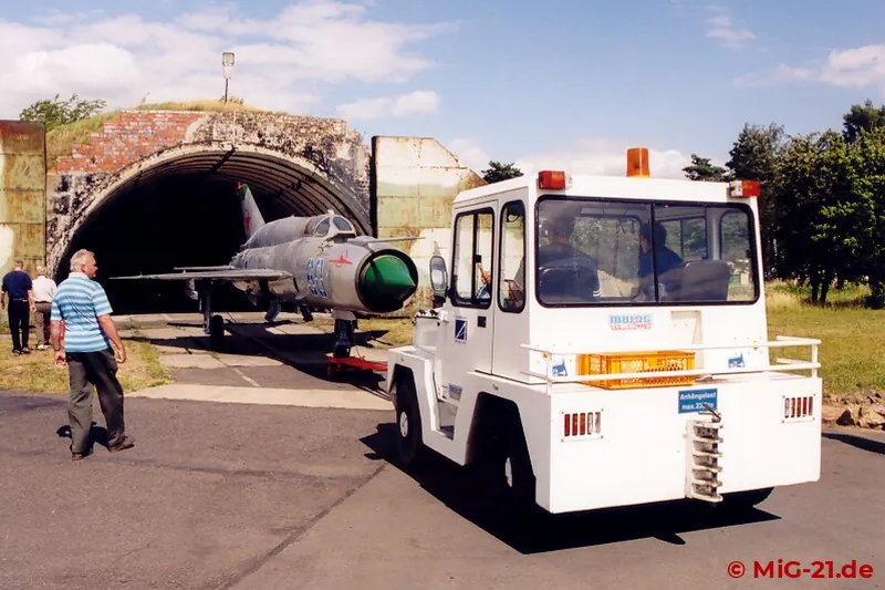 The carefully restored aircraft is towed out of the shelter and presented to the guests.