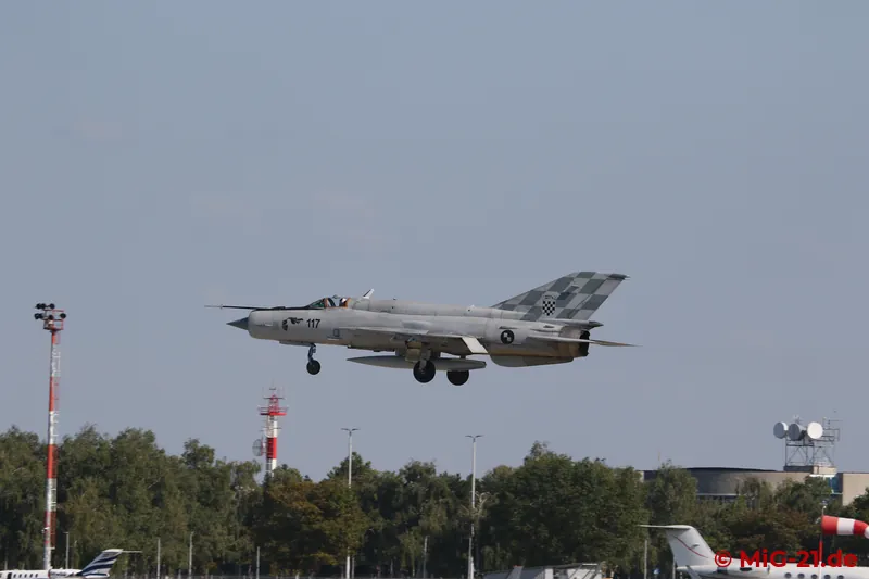 Then the MiGs come in to land individually. While the pictures of the first aircraft, 117, are still taken …