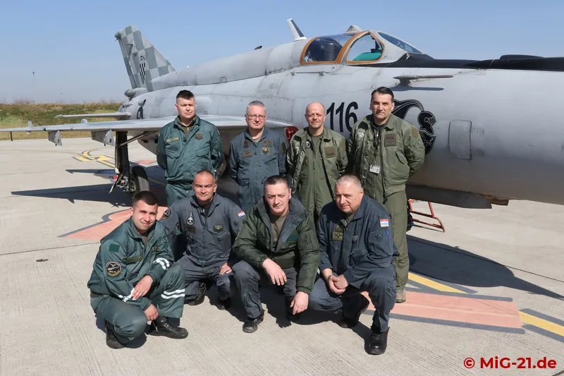 Group picture in front of a MiG-21: pilots and technicians of the 191st Eskadrila Lovačkih Aviona with their …