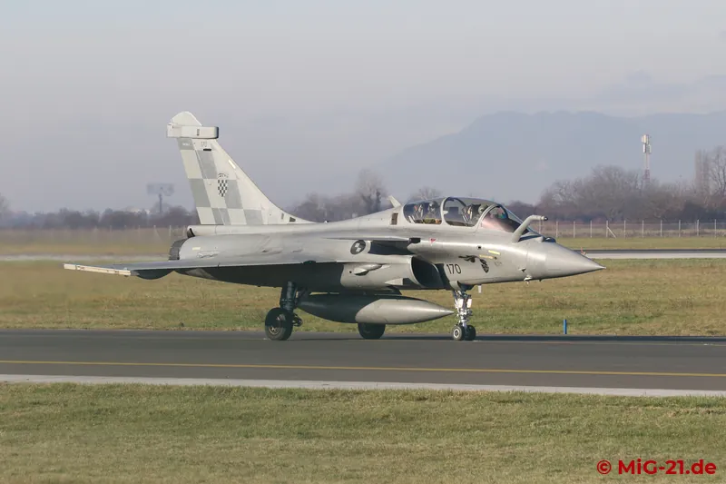 Three Rafales taxi ahead, a two-seater ...