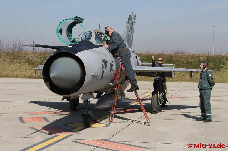 Engine run. The mechanic behind the wing signals that the flap blowing system is working correctly.