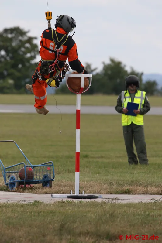 The round thing must go into the round thing. In helicopter basketball, the size of the players is irrelevant.