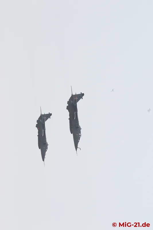 Two Jaguar fighter-bombers "attack the airfield", the MiGs in the background intercept them.