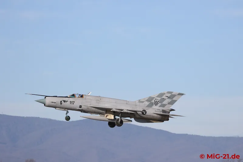 ... the pair splits again and the MiGs come in to land individually.