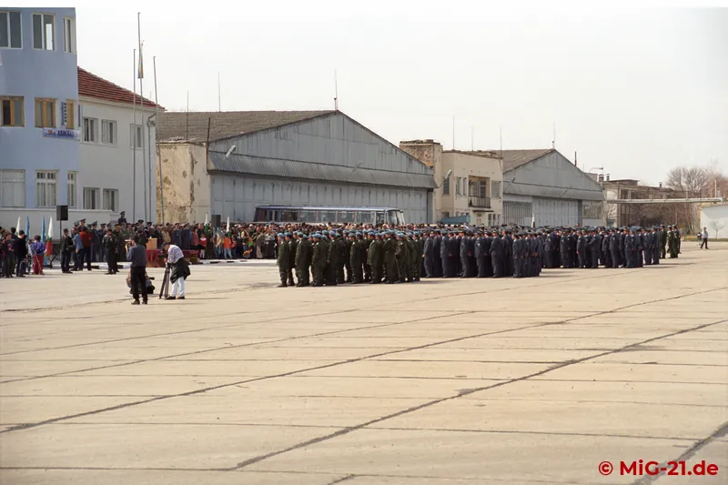 Soldiers and civilians have gathered in front of the airfield's historic buildings, built with German support …