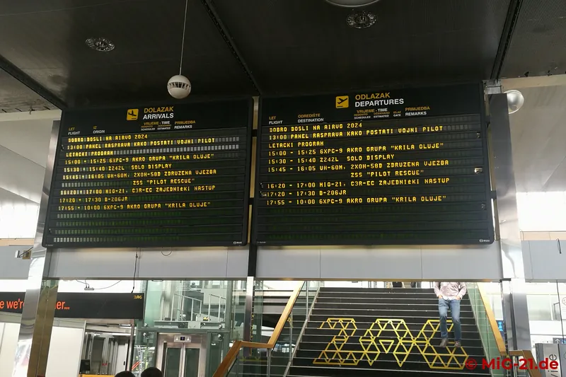Under the display board in the old Zagreb terminal announcing the programme of the event ...