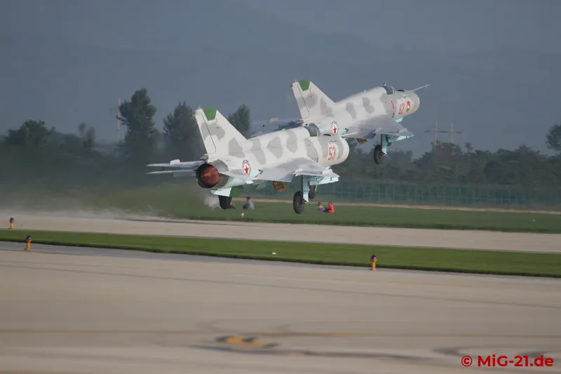 ... and the MiG-21s take off as a pair, ...