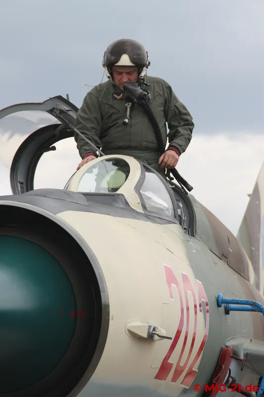 Company pilot Viorel Bilu climbs in ...