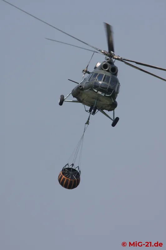 ... a fire-fighting demonstration by two Mi-8s.